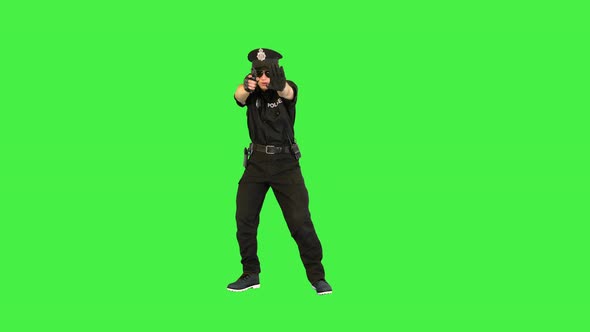 White Policeman Stands Gets the Gun Out Aims and Puts It Back on a Green Screen Chroma Key