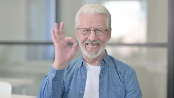 Portrait of Senior Old Man Showing Okay Sign