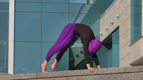 Strong Girl in Hijab Awareness Woman Yogi Female Athlete Doing Yoga Workout in City Background Surya