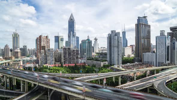 Timelapse of busy traffic road with modern office building in Shanghai china