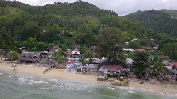 Beautiful panoramic aerial drone view of the rural town Matutinao in Cebu in the Philippines with th