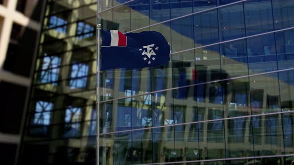 French Southern and Antarctic Lands Flag Waving On A Skyscraper Building