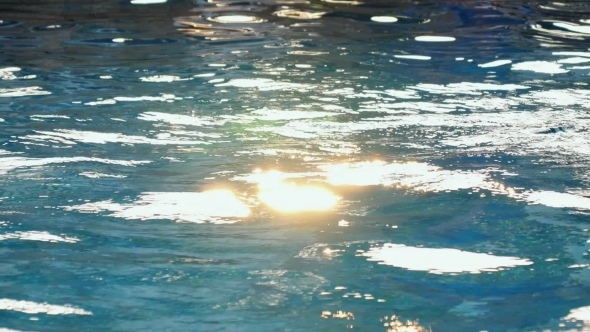 Swimming Pool Water Surface With Sparkling Light
