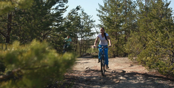 Young people riding bikes alt