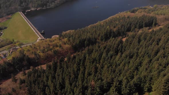 Drone travelling away from Lady Bower Reservoir Whilst panning up revealing Lady Bower Reservoir fro