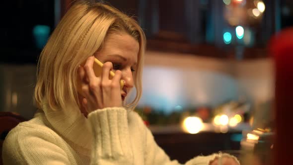 Closeup Portrait of Stressed Caucasian Wife Talking on Phone Waiting Spouse at Home in Kitchen