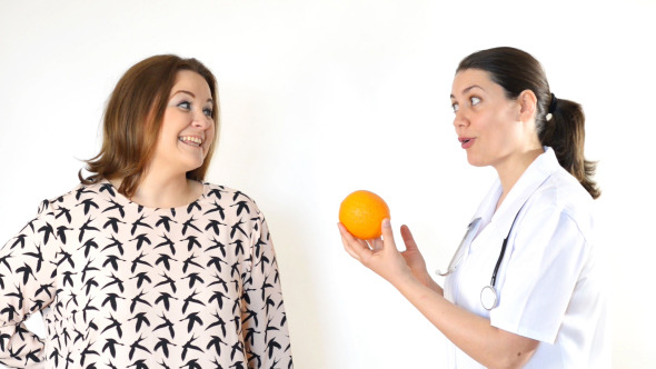 Doctor Advising a Corpulent Woman to Eat Healthy