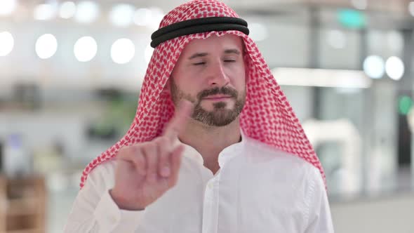 Serious Arab Businessman Saying No By Finger Sign