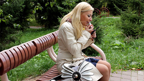 Woman Using Lipstick