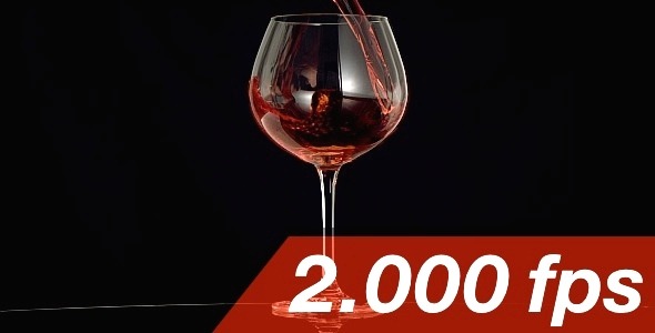 Red Wine Is Pouring Into A Wine Glass