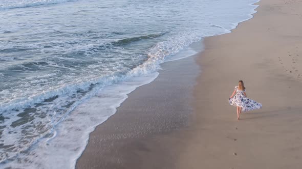 Woman Running On The Beach