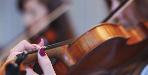 Girls Playing the Violin in the Theater