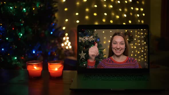 Smiling Woman on a Videocall Wishing a Merry Christmas Online