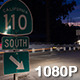 Night Traffic Rushes past Onramp Sign - VideoHive Item for Sale