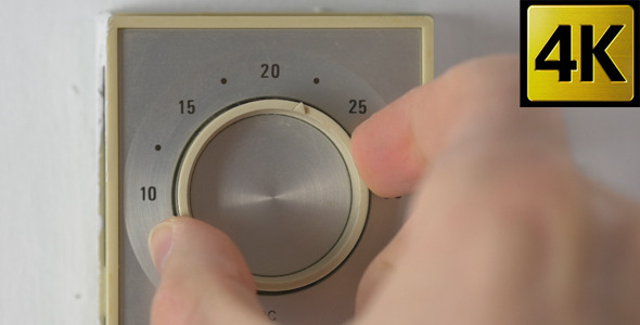 Adjusting Thermostat Temperature Dial Turning