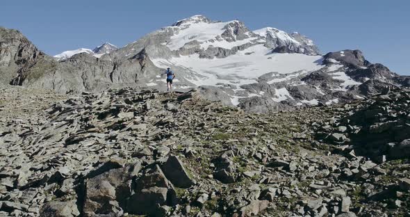 Aerial of Man Run on Ridge Edge