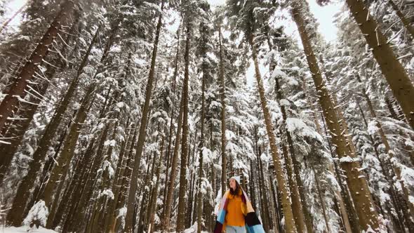 Woman Enjoying Winter Time in the Forest