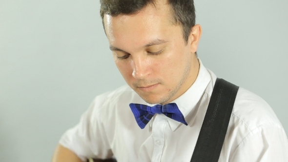 Talented Enthusiastic Guitarist Playing The Guitar