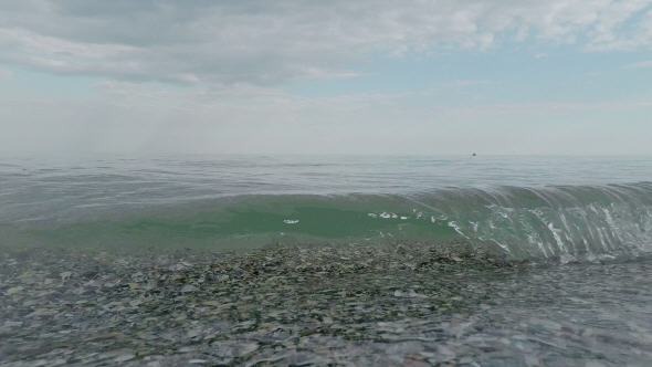 Small Waves Rolled on the Sandy Shore