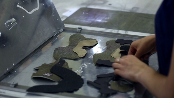 Worker Puts Stitched Parts For Production Of Boots