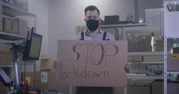 Man Holding Anti-lockdown Message