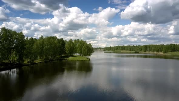 Tremendous River Separates Green Dense Forests Aerial View