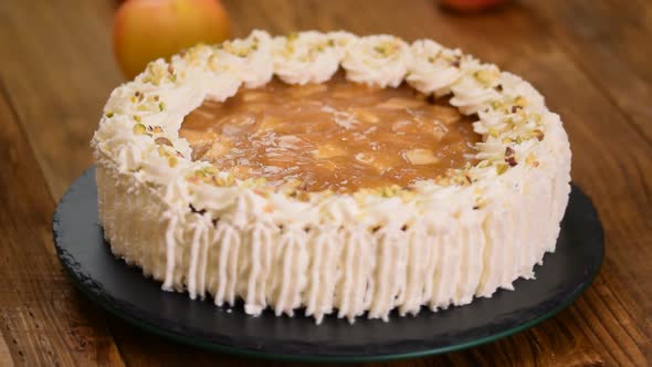 Delicious cake with apple and whipped cream filling