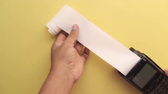 POS Machine and Long Roll Paper on Blue