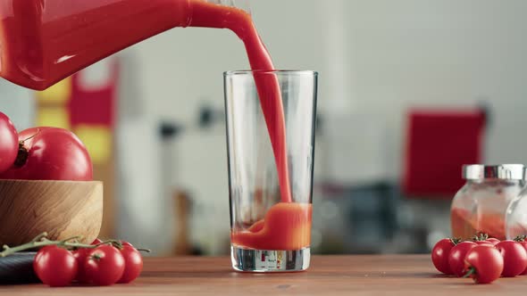 Woman Pouring Tomato Juice Fresh Red Vegetable Juice on Kitchen Table Vitamin c Italian and Spanish