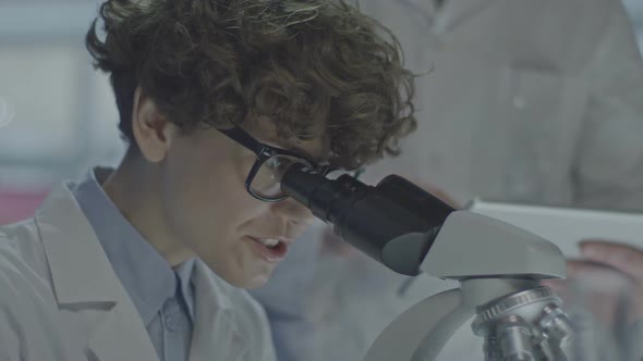 Female Scientist Looking at Sample alt