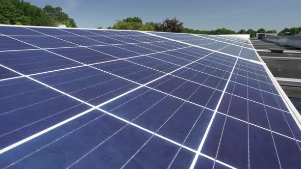 Rows of solar panels in a solar farm field on sunny day, closeup detail