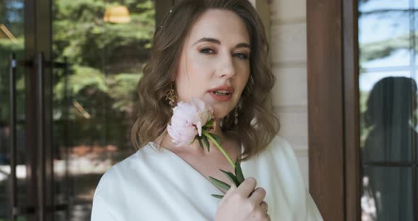 Portrait of Young Woman with Flower Tender and Romantic Model Holds Peony