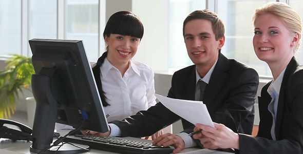 Businesspeople at office meeting alt