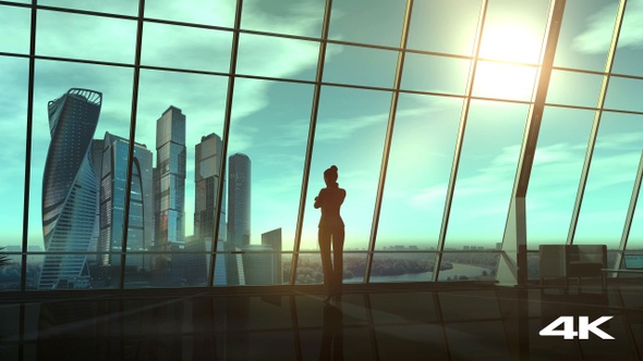 Business Woman In Office Overlooking A Business Center 4K