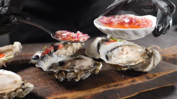 Slow Motion Sea Food Video. Big Oyster Dish. Serving Oysters in Fish Restaurant. Pouring Fresh