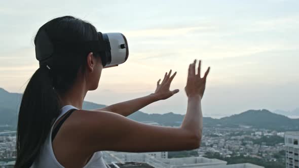 Woman looking though virtual reality device