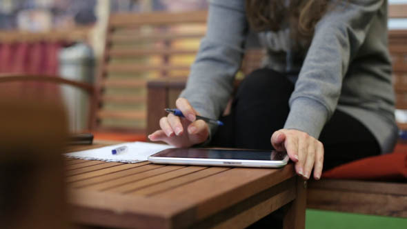 Girl Doing Calculations Using the Touch Panel