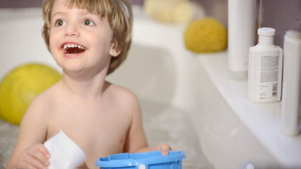 Happy Kid Playing in Bathroom