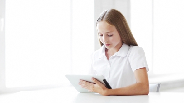 Happy Student Girl With Tablet Pc At School