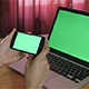 Girl Holding Smartphone with Green Screen laptop - VideoHive Item for Sale