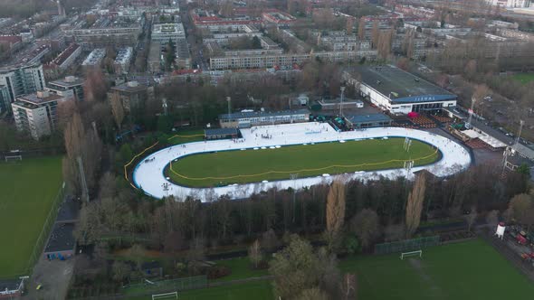Aerial Timelapse of a Recreational Outdoor Leisure Ice Skating Rink Top Down View in Amsterdam the