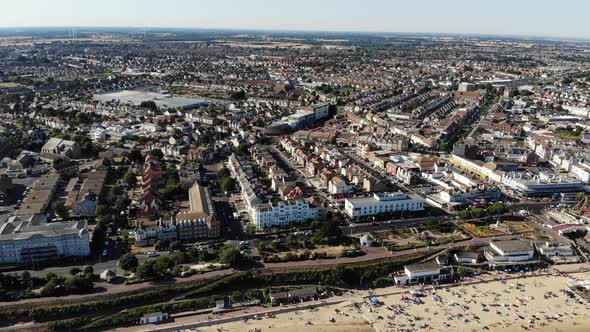 Aerial view of Clacton-on-Sea flying over the seaside hotels towards the town centre