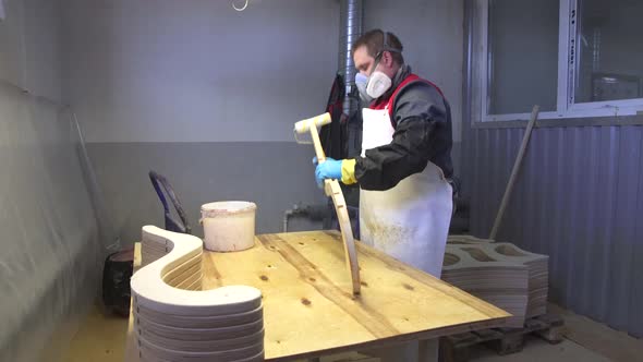 Industrial Carpenter Worker Varnishing on Wood Dolly Shot