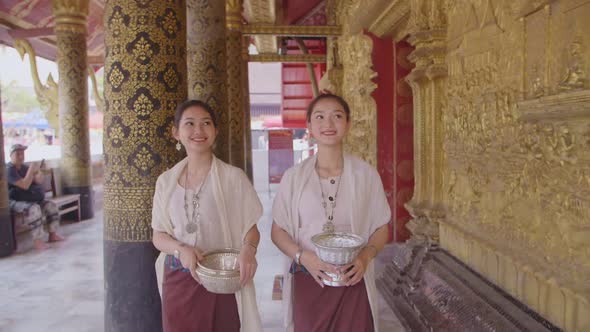 Asian Girls In Lao Traditional Costume Walking In Temple