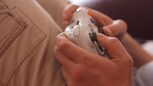 Man Playing Video Game With Joystick