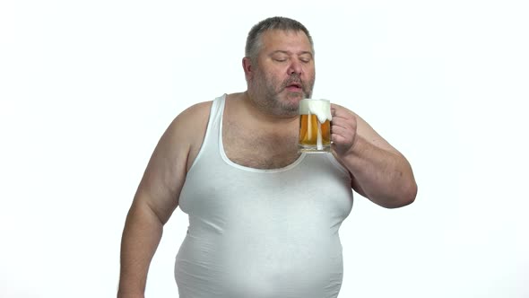 Overweight Man with Glass of Beer on White Background