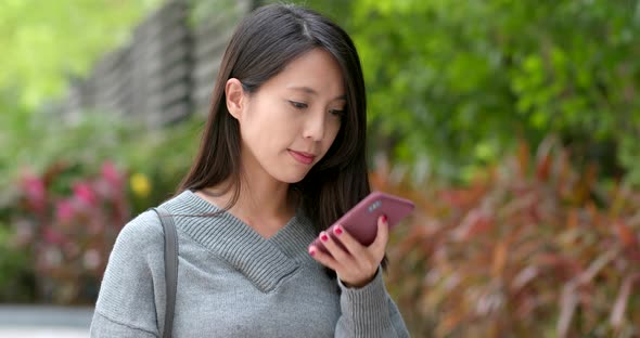 Woman use of mobile phone in city