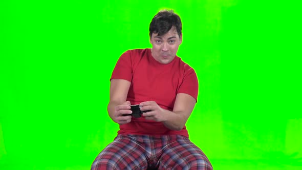 Funny Man Playing on the Gamepad in New Video Game