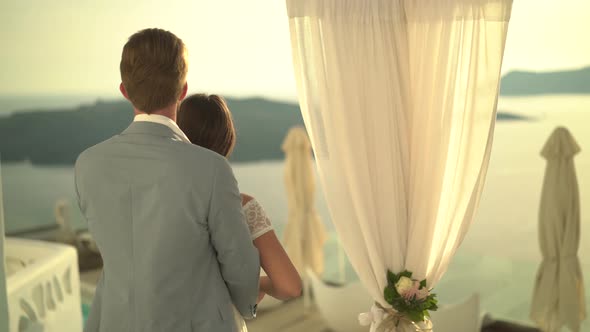 Back View Married Couple on Terrace at Sunset