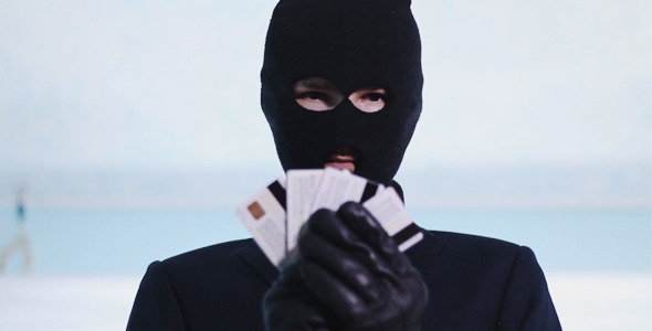Thief Shows a Stolen Bank Card